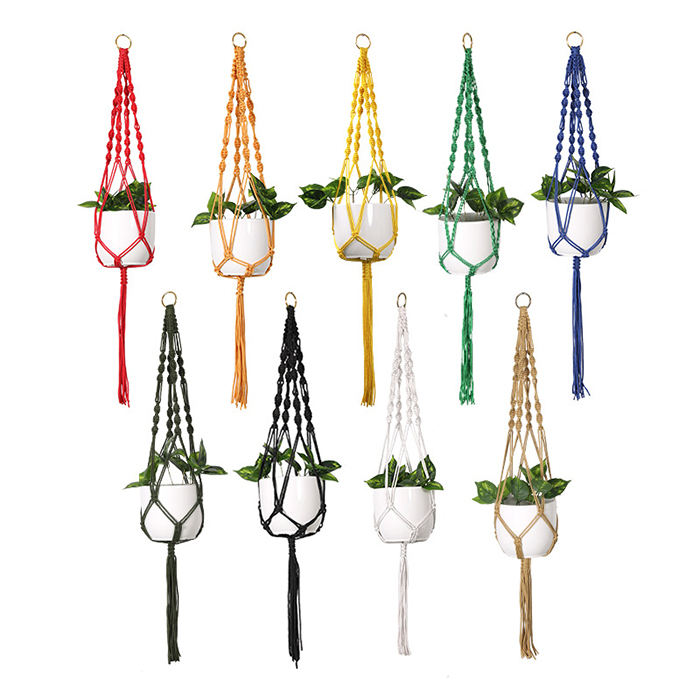Set of 10 macrame plant hangers in various colors with white pots containing green plants on a white background.